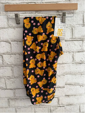 NEW LulaRoe OS Ducky yellow orange Leggings ONE SIZE Black Background